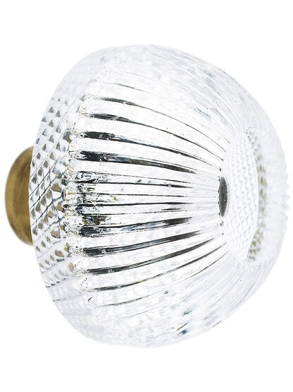Fluted Round Crystal Knob with Solid Brass Base in Antique Brass.